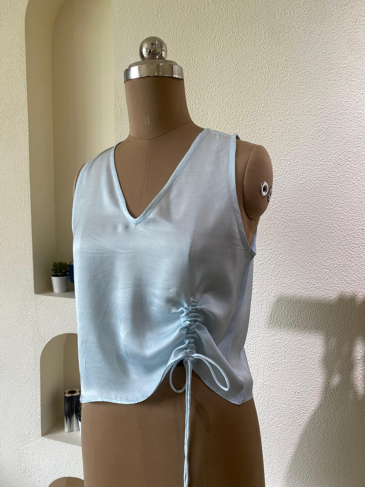 Light blue top