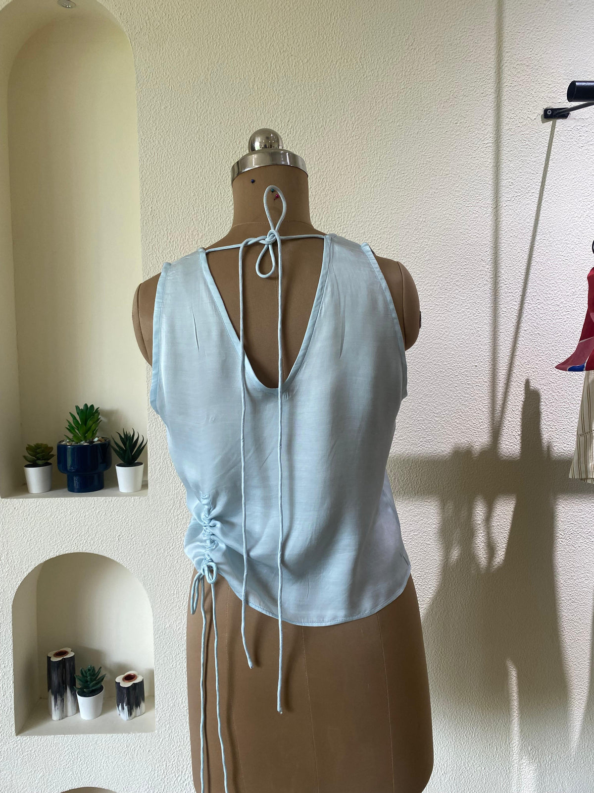Light blue top